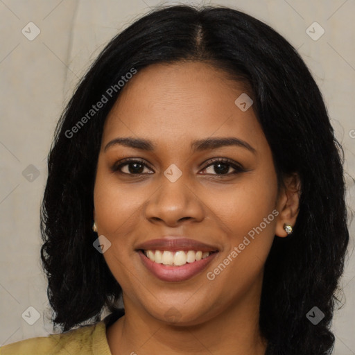 Joyful black young-adult female with long  black hair and brown eyes