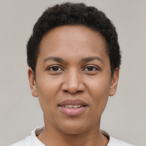 Joyful latino young-adult female with short  brown hair and brown eyes