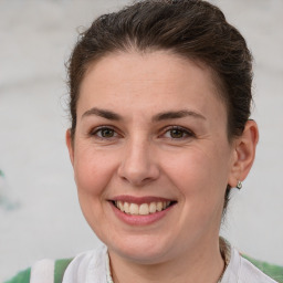 Joyful white adult female with short  brown hair and brown eyes