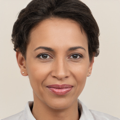 Joyful white adult female with short  brown hair and brown eyes