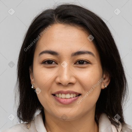 Joyful asian young-adult female with long  brown hair and brown eyes