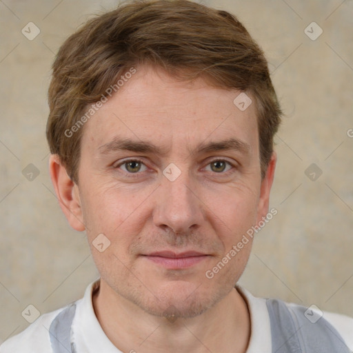 Joyful white adult male with short  brown hair and grey eyes