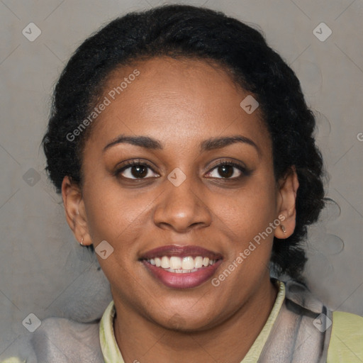 Joyful black young-adult female with short  brown hair and brown eyes