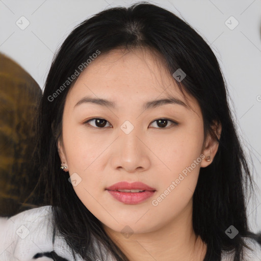 Joyful asian young-adult female with medium  black hair and brown eyes