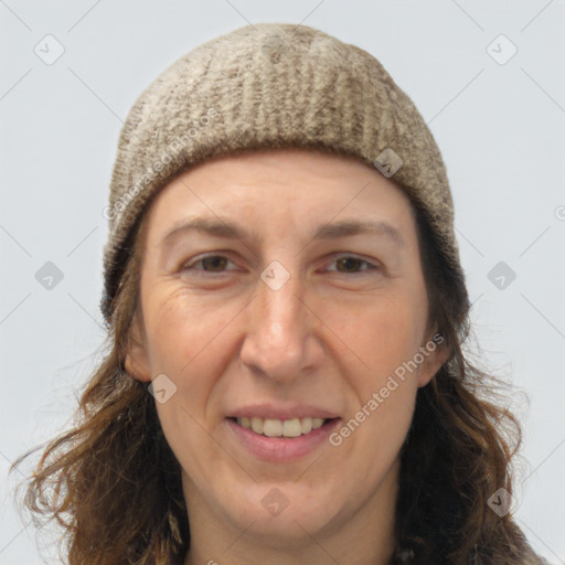 Joyful white adult female with long  brown hair and brown eyes