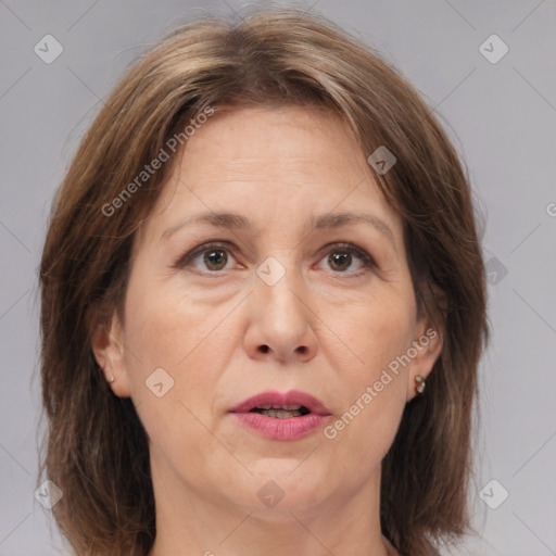 Joyful white adult female with medium  brown hair and brown eyes