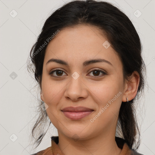 Joyful latino young-adult female with medium  brown hair and brown eyes