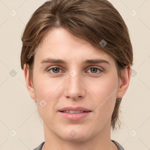 Joyful white young-adult female with medium  brown hair and grey eyes