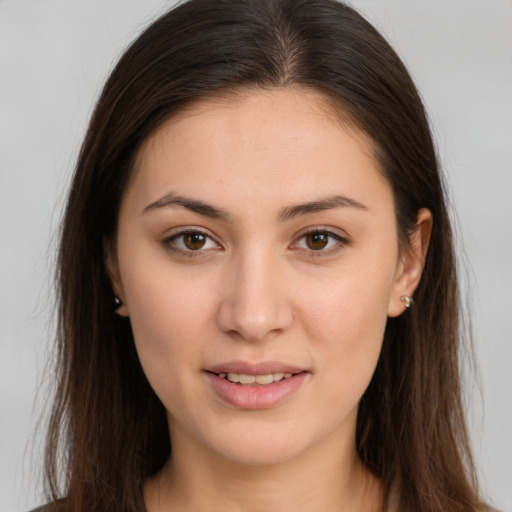 Joyful white young-adult female with long  brown hair and brown eyes