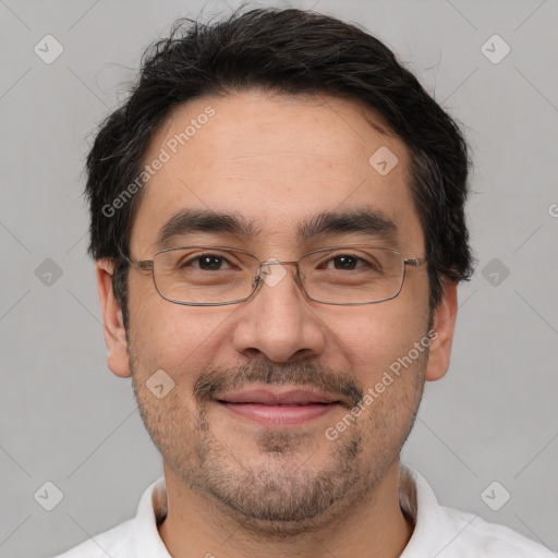 Joyful white adult male with short  black hair and brown eyes