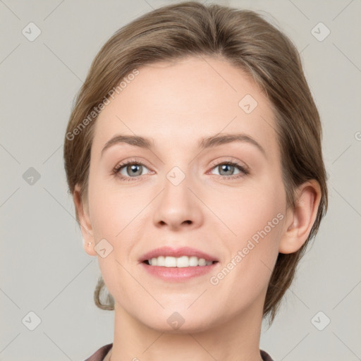 Joyful white young-adult female with short  brown hair and grey eyes