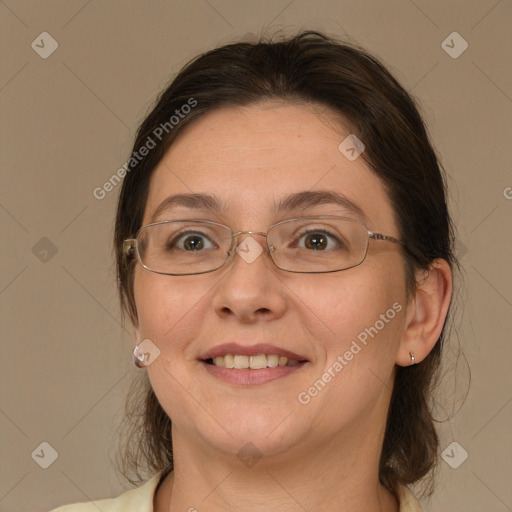 Joyful white adult female with medium  brown hair and brown eyes