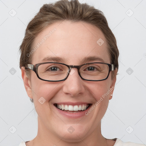 Joyful white young-adult female with short  brown hair and grey eyes