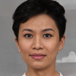 Joyful asian young-adult female with short  black hair and brown eyes