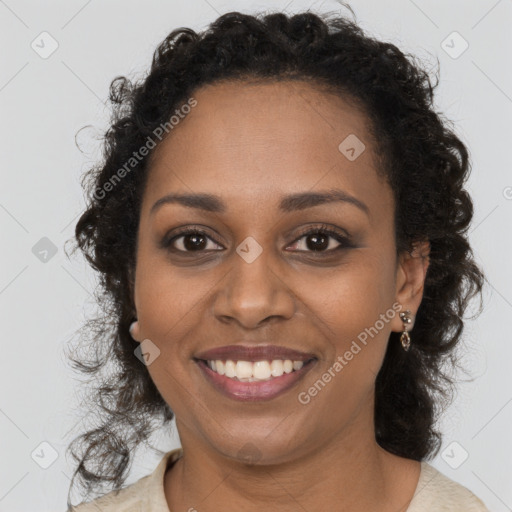 Joyful black young-adult female with long  brown hair and brown eyes