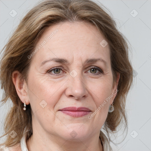 Joyful white adult female with medium  brown hair and grey eyes