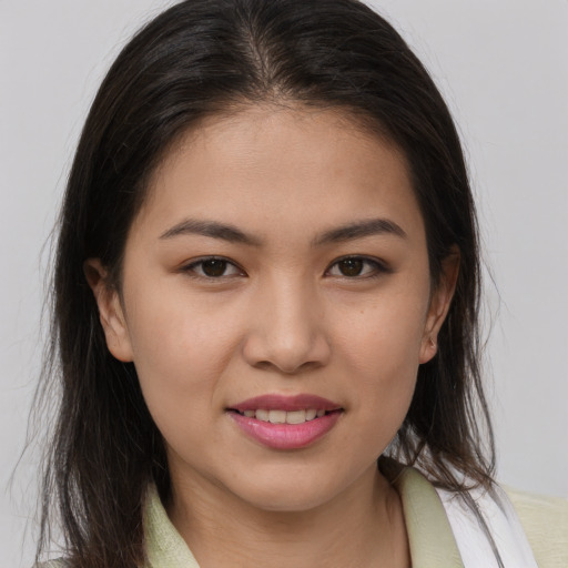 Joyful white young-adult female with medium  brown hair and brown eyes