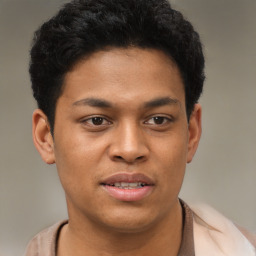 Joyful latino young-adult male with short  brown hair and brown eyes