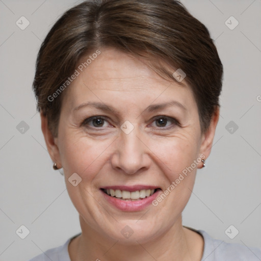 Joyful white adult female with short  brown hair and brown eyes