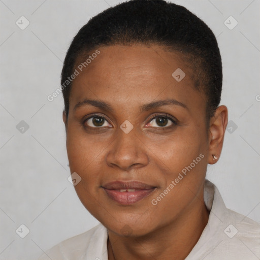 Joyful black young-adult female with short  brown hair and brown eyes