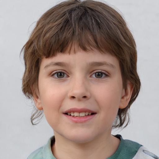 Joyful white child female with medium  brown hair and grey eyes