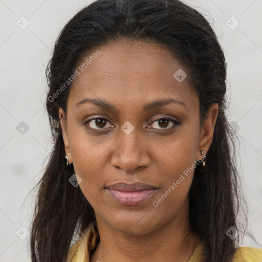 Joyful black young-adult female with long  brown hair and brown eyes