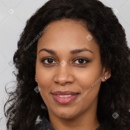 Joyful black young-adult female with long  black hair and brown eyes