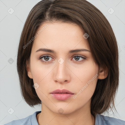 Neutral white young-adult female with medium  brown hair and brown eyes