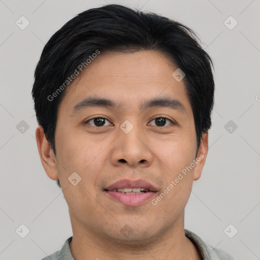 Joyful asian young-adult male with short  black hair and brown eyes