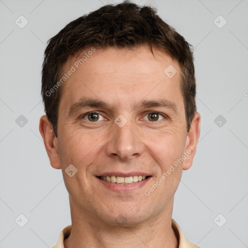 Joyful white adult male with short  brown hair and grey eyes