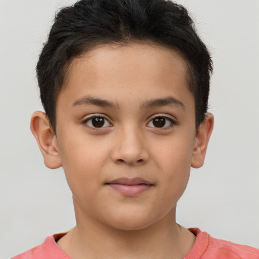 Joyful white child male with short  brown hair and brown eyes