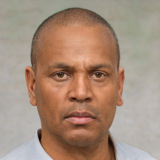 Neutral latino adult male with short  brown hair and brown eyes