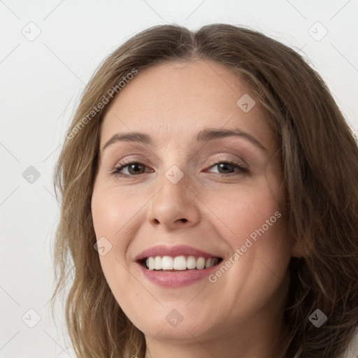 Joyful white young-adult female with long  brown hair and grey eyes