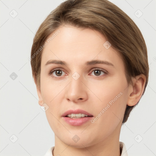 Joyful white young-adult female with short  brown hair and grey eyes