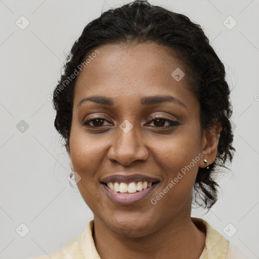 Joyful black young-adult female with medium  brown hair and brown eyes