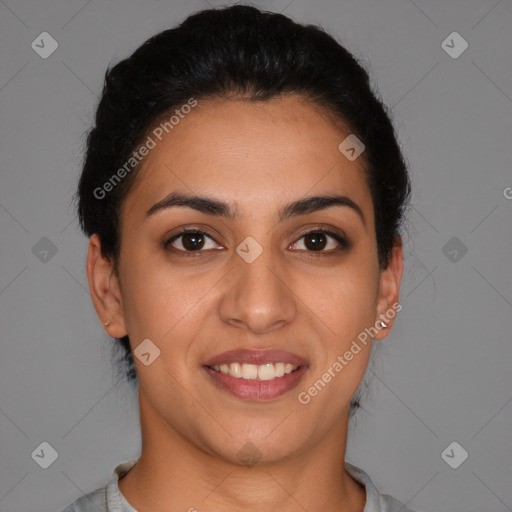 Joyful latino young-adult female with short  brown hair and brown eyes