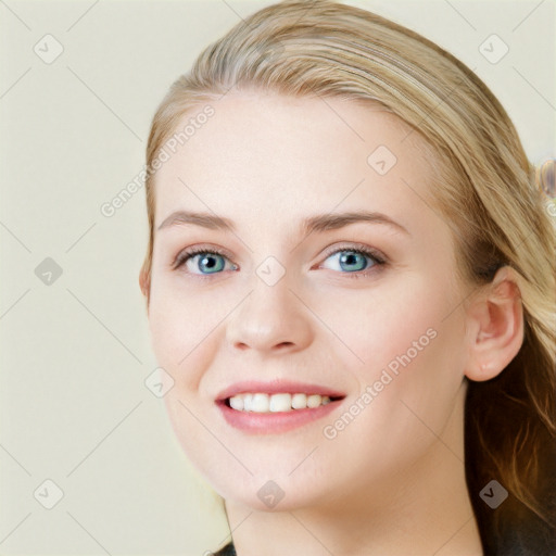 Joyful white young-adult female with long  brown hair and blue eyes