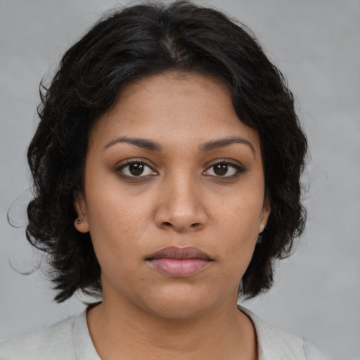 Neutral latino young-adult female with medium  brown hair and brown eyes