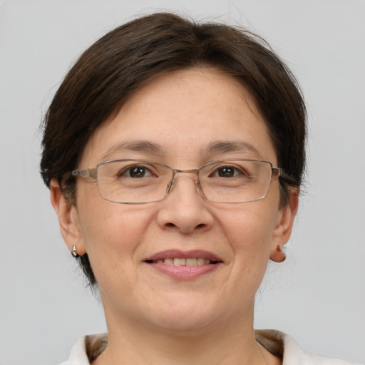 Joyful white adult female with short  brown hair and brown eyes