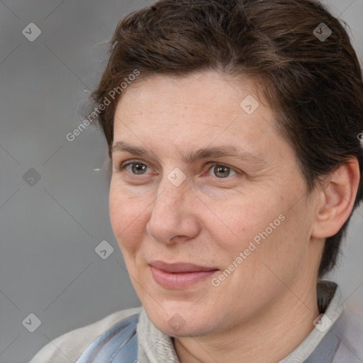 Joyful white adult female with short  brown hair and brown eyes