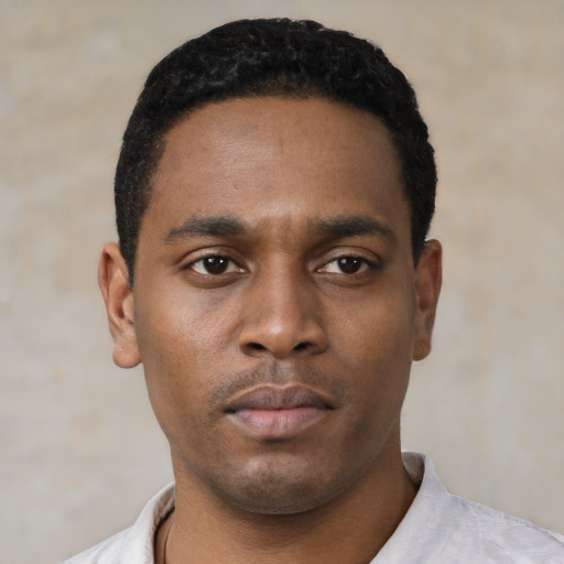 Neutral black young-adult male with short  black hair and brown eyes