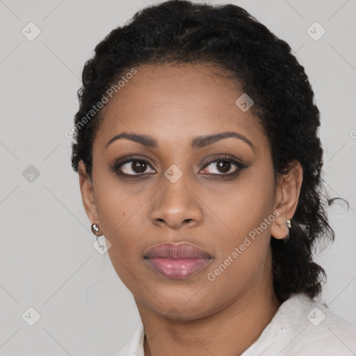 Joyful black young-adult female with short  black hair and brown eyes