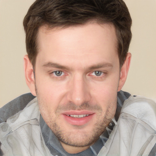 Joyful white adult male with short  brown hair and grey eyes