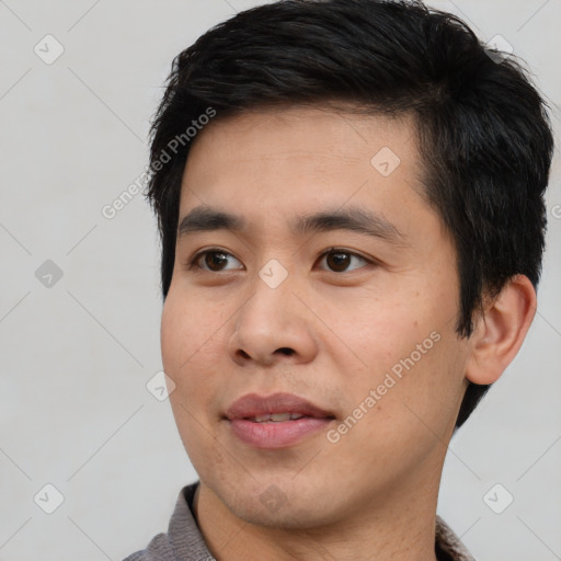 Joyful white young-adult male with short  black hair and brown eyes