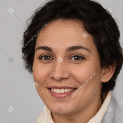 Joyful white adult female with short  brown hair and brown eyes