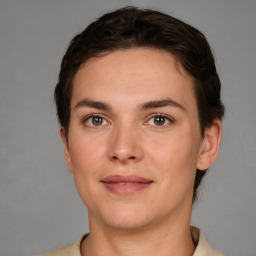 Joyful white young-adult female with short  brown hair and grey eyes