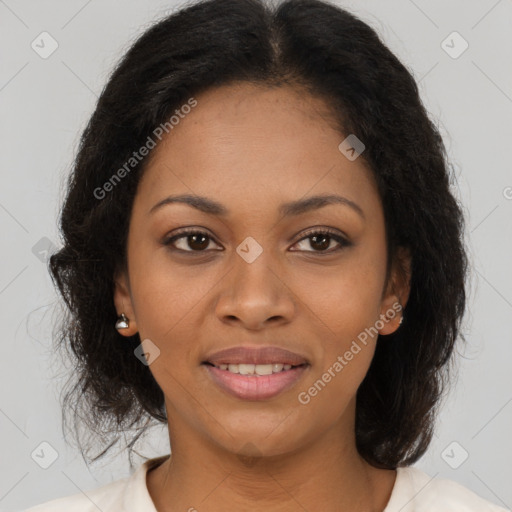 Joyful black young-adult female with long  brown hair and brown eyes