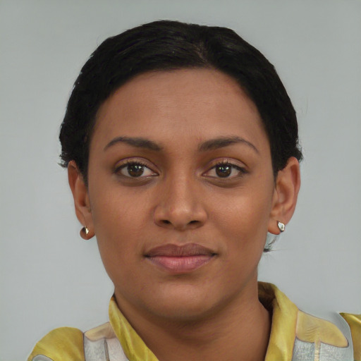 Joyful latino young-adult female with short  black hair and brown eyes