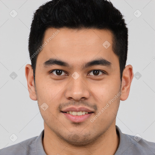 Joyful white young-adult male with short  black hair and brown eyes