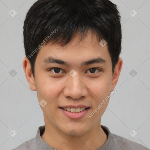 Joyful asian young-adult male with short  brown hair and brown eyes